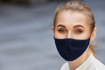 business woman in protective medical mask outdoors