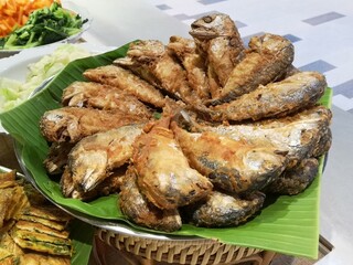 Fried mackerel in market