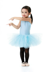 Naklejka premium Portrait isolated studio shot of little cute Asian preschool pigtails hairstyle ballerina dancer girl in blue tutu ballet dress black legging stand smiling posing pointing fingers on white background