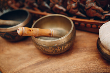 Stuff tibetan bowl accessories for thai massage procedure at beauty spa.