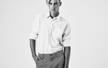 man fashionable hairstyles in suit posing professional light background