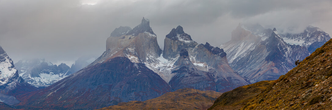 panoramic image of the jagged mountain peaks of Los Cuernos in the Paine Mountain range, Chile