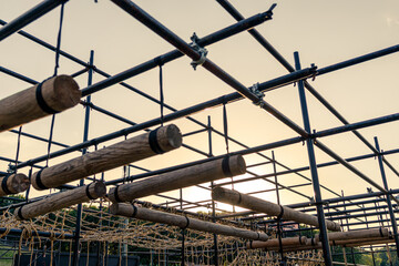 Obstacle course race ocr, horizontal logs in a row, sunset