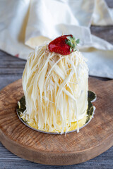 White chocolate cake on wood background