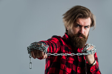 Brutal bearded man pull steel chain, Break the vicious circle