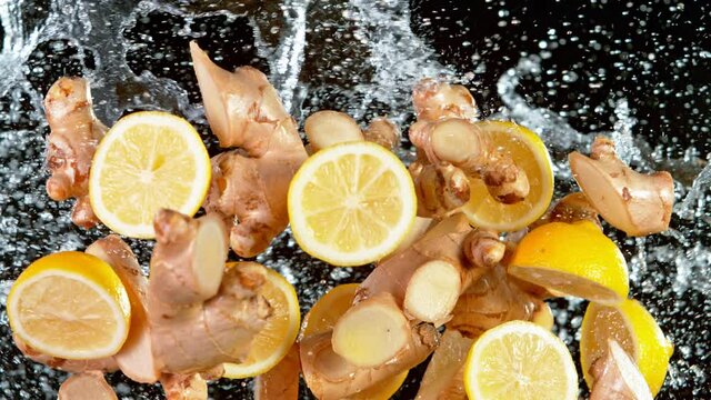 Super Slow Motion Shot of Flying Ginger Cuts, Lomen Slices and Water Side Splash at 1000 fps.