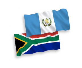 National vector fabric wave flags of Republic of Guatemala and Republic of South Africa isolated on white background. 1 to 2 proportion.