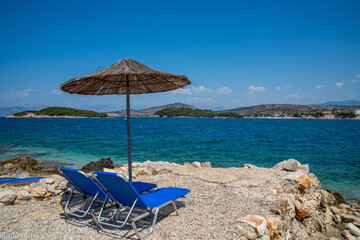 beach chairs and umbrella