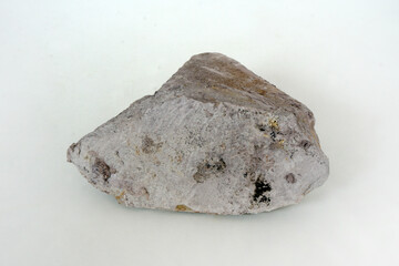 specimen of shale mudstone rock on white background.