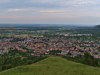 Fototapeta na wymiar Aerial view of small town Weilheim an der Teck, Baden-Württemberg, Germany, located on the foothills of Swabian Alb, viewed from Limburg hill.