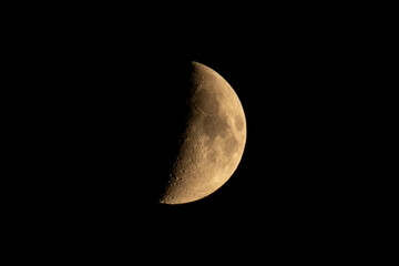 Moon in the black sky with stars. Young moon