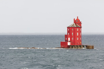 One of Norway's most distinctive lighthouses is used by ships entering or leaving the fjord near...