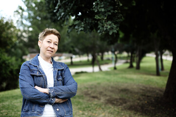 Outdoor portrait of 50 years old woman - 453460818