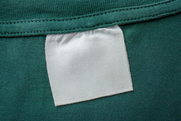 Cotton laundry care clothing label on fabric texture with place for text on fabric texture. Clothes...