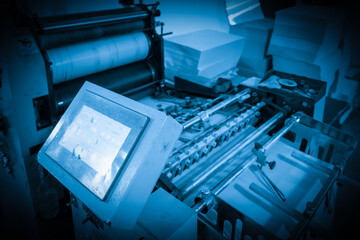 The offset press in the production process is in the printing factory