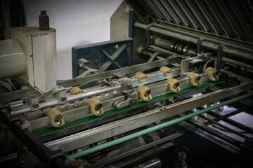 The offset press in the production process is in the printing factory