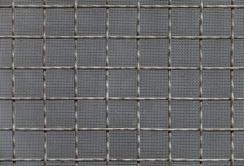 Metal wire screen pattern for gray silver textured grid fence background