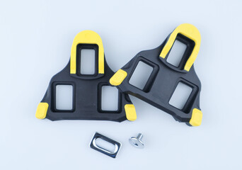 Road cycling cleats or clip less pedal on white background