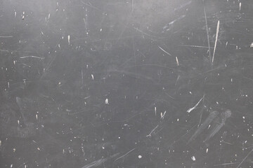 Gray surface wall with scratches and white paint streaks. Abstract backdrop