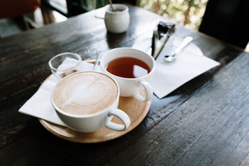 Foamed milk latte heart, Cup of hot coffee on the table in a cafe