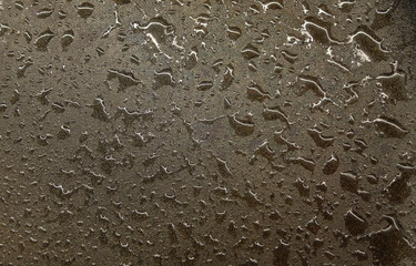 Wet water splotches on gray concrete stone floor. Abstract backdrop concept