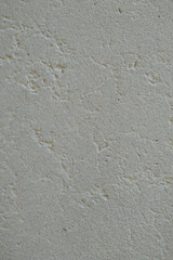 Old white wall with rivets and cracks from weathering. Backdrop pattern