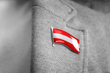 Metal badge with the flag of Austria on a suit lapel