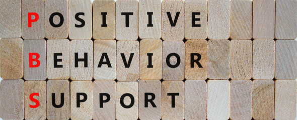 Positive behavior support symbol. Concept words Positive behavior support on wooden blocks on a...
