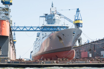 military ship repaired in a dry dock