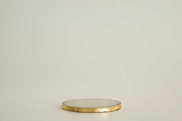 Marble podium with gold on the white background. Podium for product, cosmetic presentation....