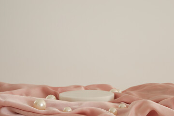 White marble podium on the pink silk fabric with pearls, white background. Podium for product,...