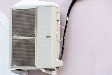 An outdoor air conditioner unit consisting of two fans. A large industrial air conditioner on the...