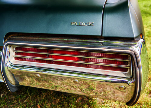 Buick detail backward shot of the classic car from the General Motors group with taillight and chrome bumper in Lehnin, Germany, August 21, 2021