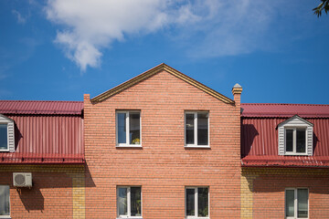 Red brick building with roof