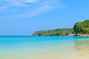 Fototapeta na wymiar Crystal clear water at Surin Beach, famous tourist destination, Phuket, Thailand