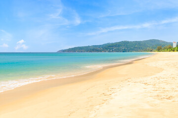 Fototapeta na wymiar Karon Beach with crystal clear water and wave, famous tourist destination and resort area, Phuket, Thailand