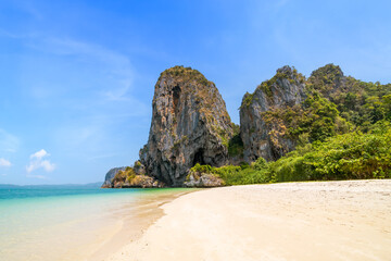 Ao Phra Nang near Railay beach with crystal clear water and exotic landmark limestone cliff...