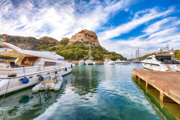 Fototapeta na wymiar Splendid view of Poltu Quatu port and bay with luxury yachts on Costa Smeralda.