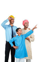 Young indian engineer with farmer and his child on white background.