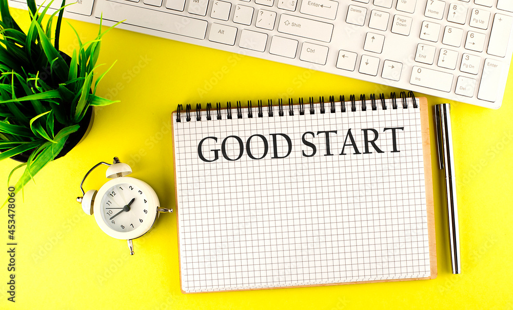 Poster word writing text good start . business concept on the notebook with keyboard on yellow background