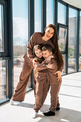 Cheerful mother and her children in the studio