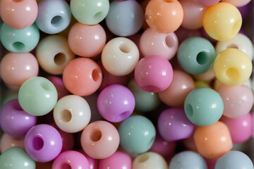 close up Multicolored plastic beads texture background. Top view