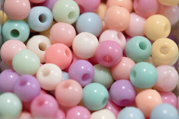 close up Multicolored plastic beads texture background. Top view