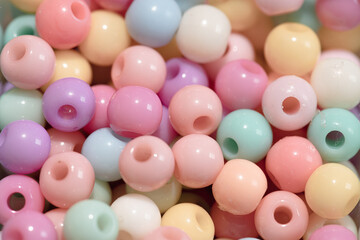 close up Multicolored plastic beads texture background. Top view