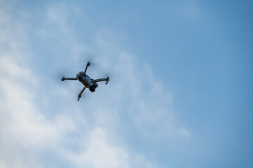 Fototapeta na wymiar UAV flying in the blue sky