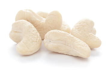 Micro close-up and details of Organic Indian dry fruit cashew nut (Anacardium occidentale)    isolated over white background.