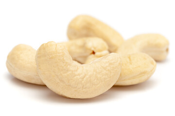 Micro close-up and details of Organic Indian dry fruit cashew nut (Anacardium occidentale)    isolated over white background.