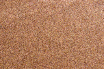 Fototapeta na wymiar Sandpaper texture background makes the pattern of sand grains on sandpaper look beautiful. It is suitable as background to use in texting because there is Copy Space for designers to use on sandpaper.