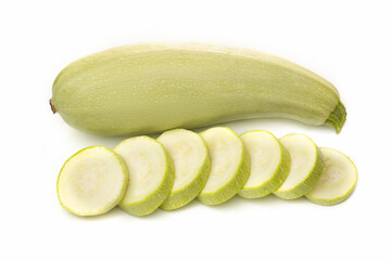Fresh white zucchini with sliced pieces on a white background.