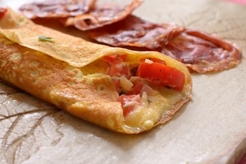 Omelet with tomato, cheese and marijuana leaf 